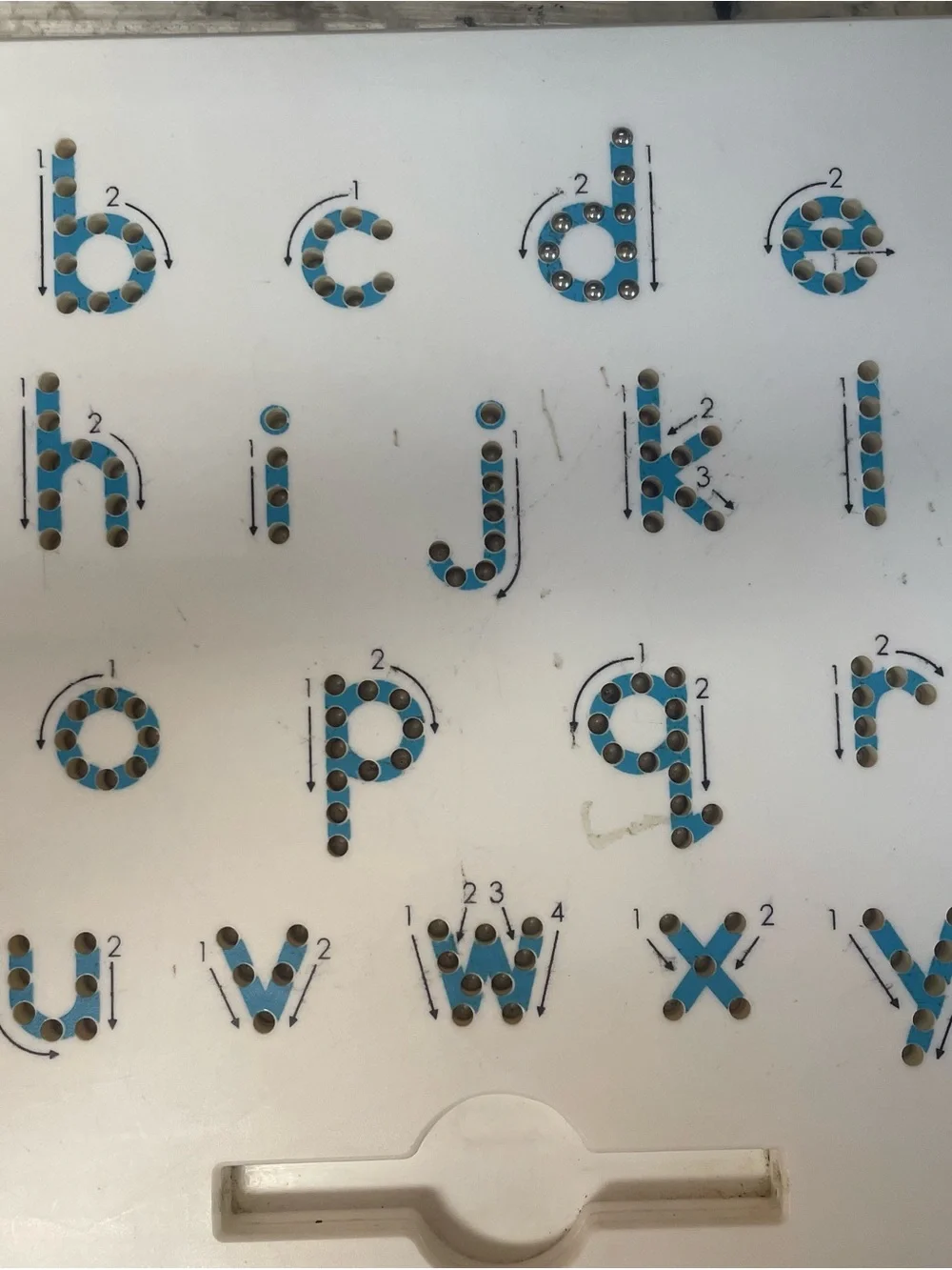 Magnetic ball board to teach/train proper letter formation